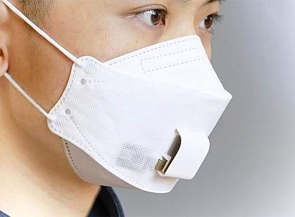 A woman wearing an EBCare smart mask, a paper mask with sensors in the area over the mouth.