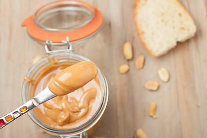 A small amount of peanut butter on a knife.