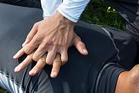 Image of two hands in a CPR position over a person’s chest