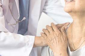 Image of a doctor consoling a patient