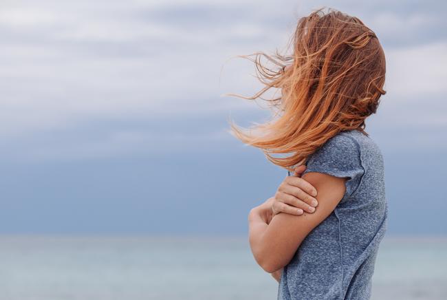 woman looking at the beach