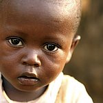 Close-up of an African boy looking at the camera.
