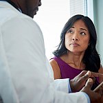 Doctor speaking with a female patient.