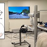 Man with two devices implanted in his brain before a bionic arm controlling a steering wheel and a screen showing traffic. An inset illustration shows movement across a grid reflected on fingers. 